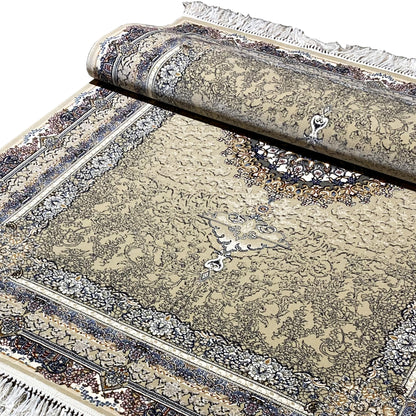 Close-up of a rolled carpet edge: beige ornamental design with a dark blue border and fringes