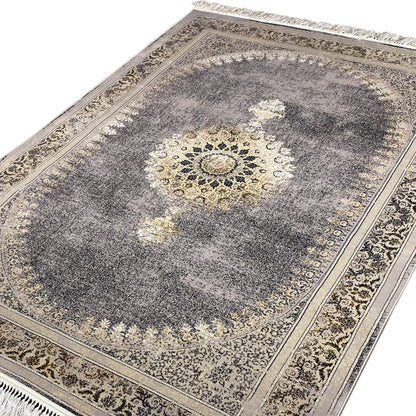 Medallion rug with a central ornament in light gold on dark gray and fringes