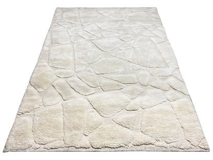 Berber rug 239x170 cm, light beige, photographed in a trapezoidal shape with a relief pattern