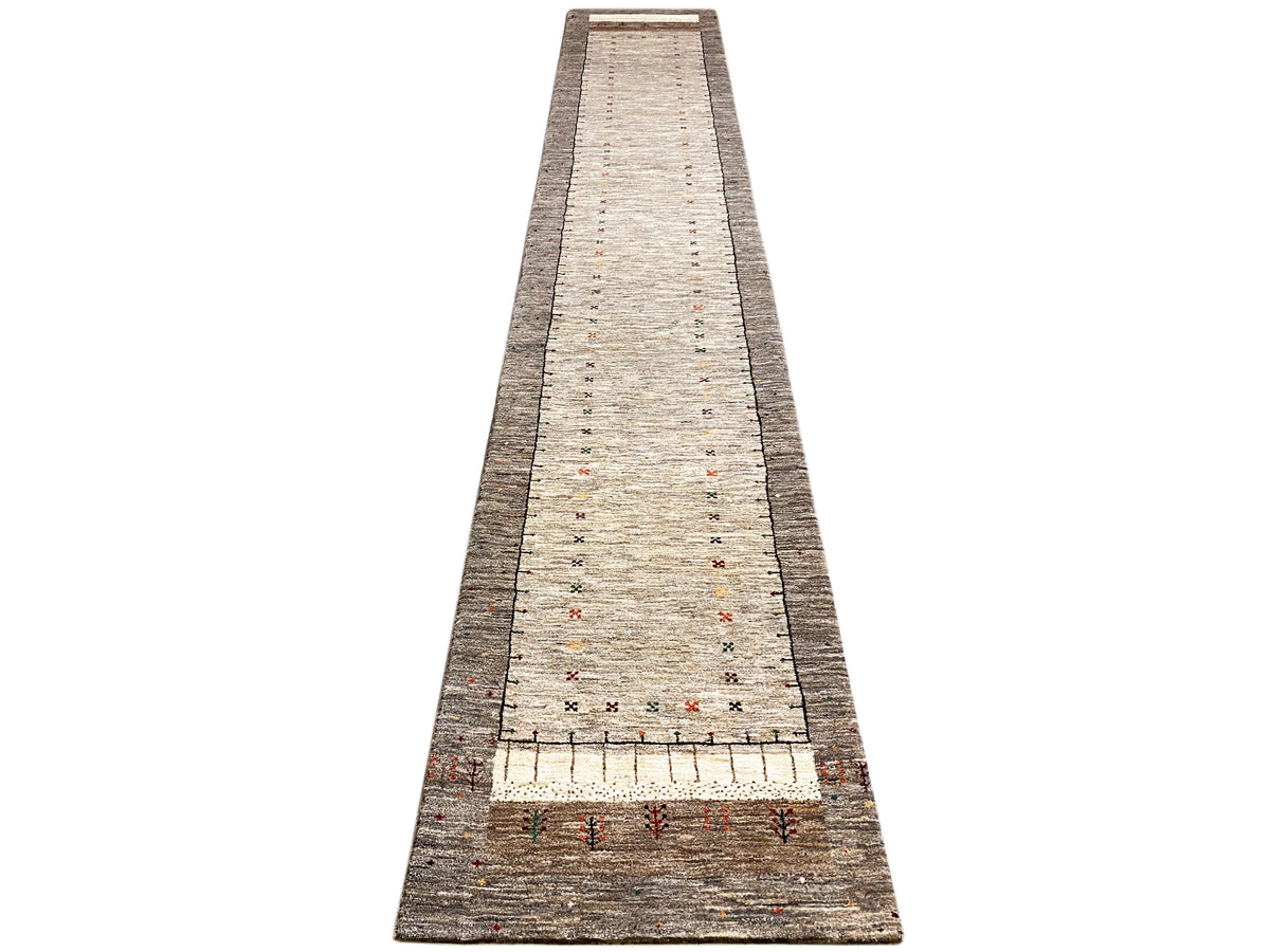 Gabbeh runner from the front: narrow hallway runner with a light beige central stripe and border