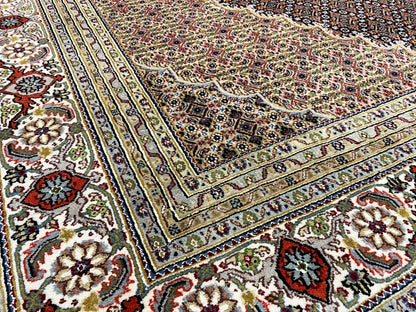 Carpet pattern with ornamental corners and surrounding lines in beige, blue, and red