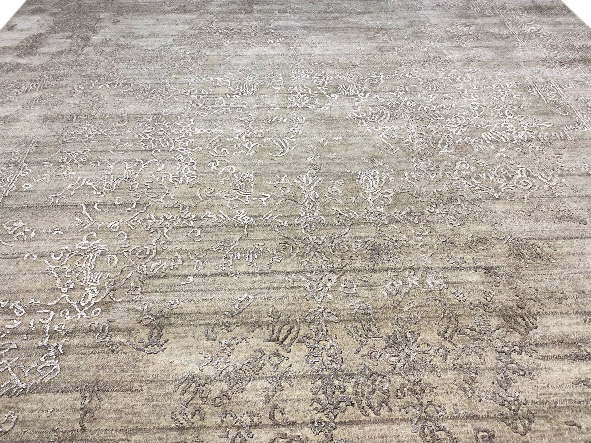 Gray designer rug with offset ornamental and linear elements across the surface