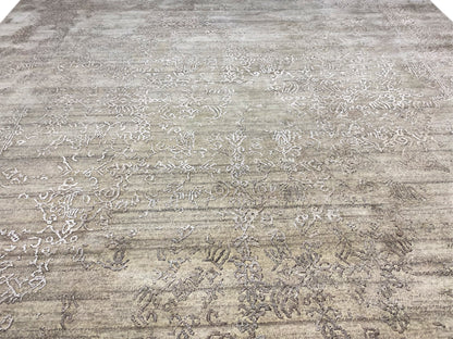 Gray designer rug with offset ornamental and linear elements across the surface
