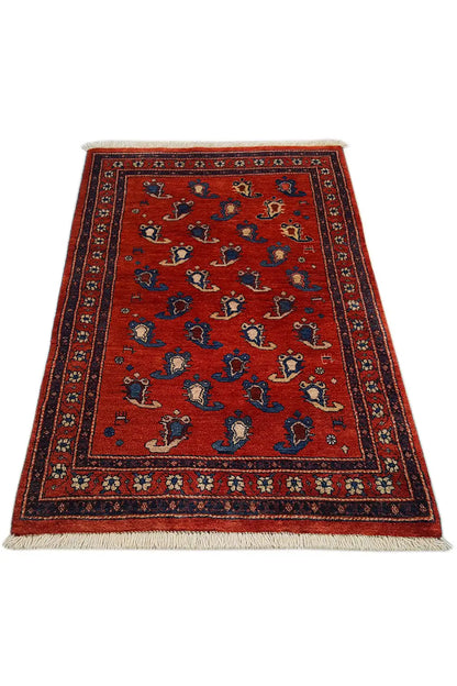 Oriental rug 126×81 cm: red ground pattern with blue ornament and border