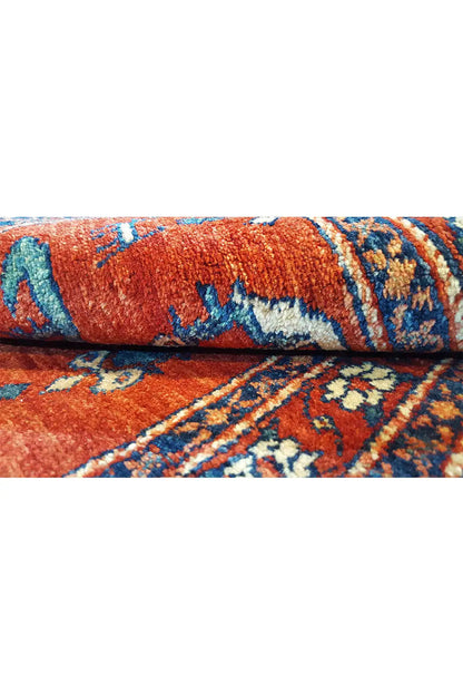 Carpet detail: red pile with a blue patterned stripe and bound edges