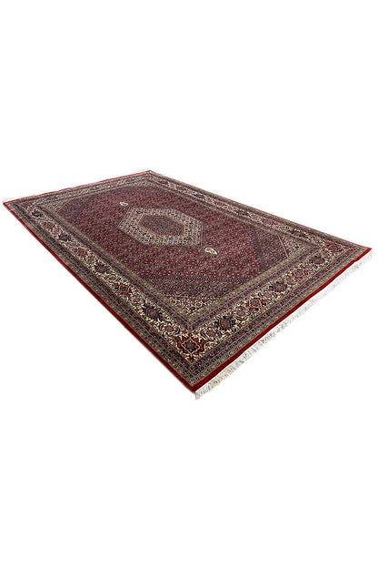 Bidjar rug 303x200 cm, photographed at an angle, red field with geometric medallion