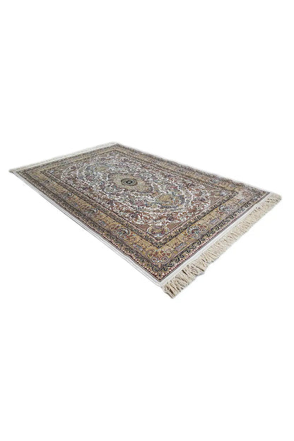 Rug shown at an angle with a clear border and medallion, multicolored, fringes
