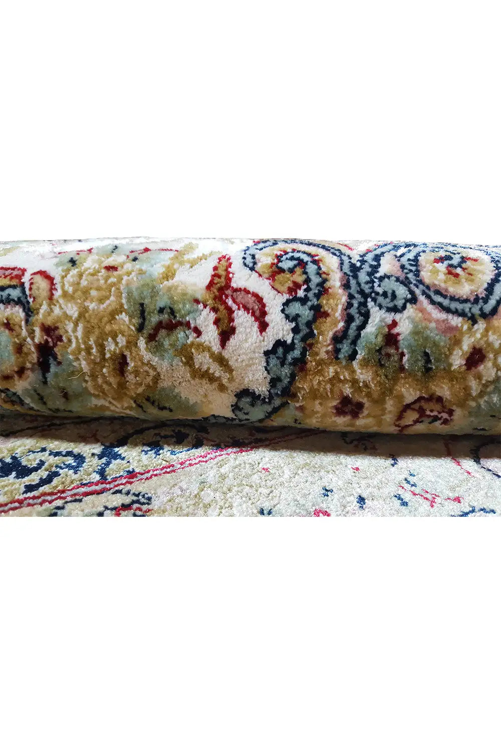 Close-up: rug with a multicolored raised pattern, border trim, and sewn seam