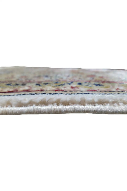 Close-up view of the rug edge with fringe and dyed pile, multicolored patterned stripes