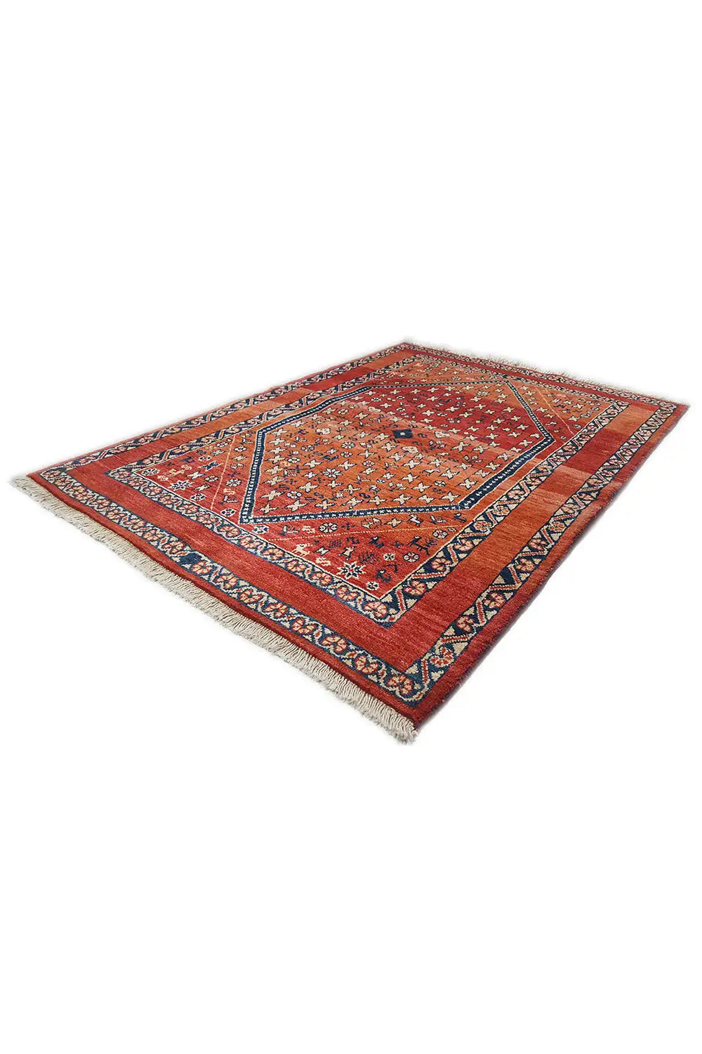 Oriental rug with a red central field, blue diagonal border, and cross motifs