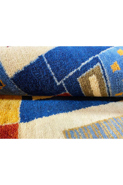 Oriental rug detail: blue and beige block stripes with red accents, close-up of the pile