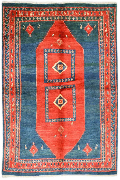 Rug with a blue ground, red medallion, and geometric border design