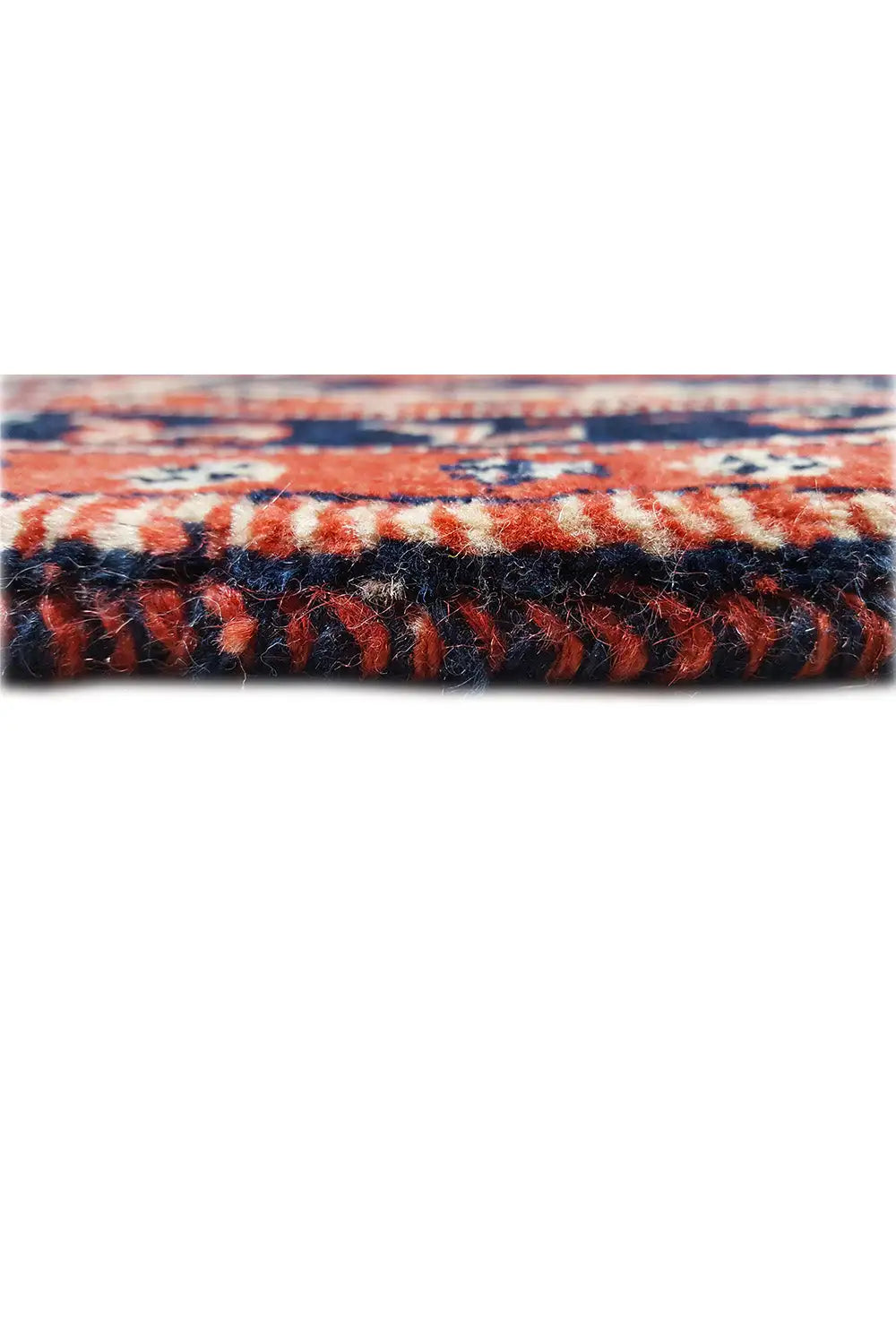 Carpet edge detail: blue-red embroidery and short pile