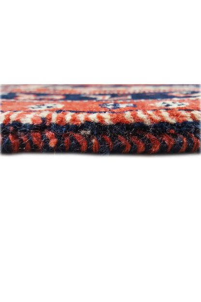 Carpet edge detail: blue-red embroidery and short pile