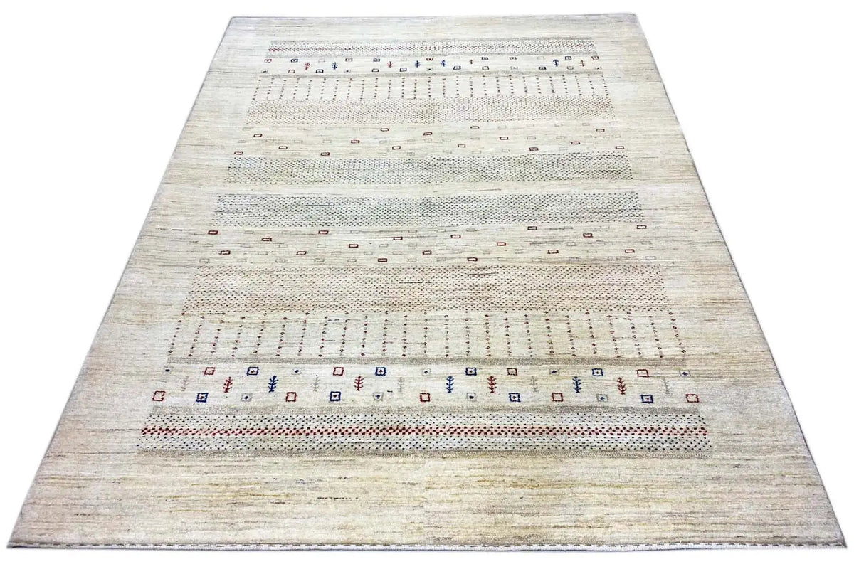 Rectangular gabbeh rug in beige with stripes of small geometric motifs