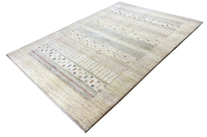 Gabbeh rug, laid out diagonally: light base color with multi-row patterned stripes