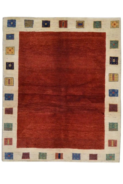 Gabbeh rug, 190x156 cm: red central field, beige border with small colorful squares.