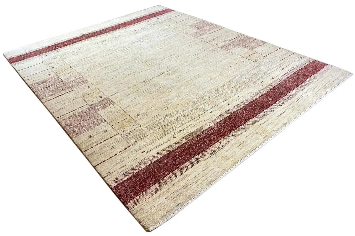 Gabbeh rug with a beige background, dark red border line, and block pattern