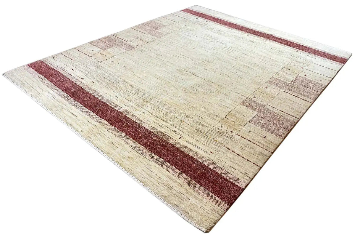 Gabbeh rug, diagonal beige pattern with a dark red border stripe