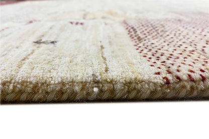 Gabbeh rug edge: beige pile with a dark red stripe, with fringes