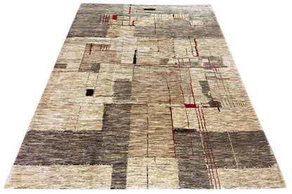 Gabbeh Lori rug with a geometric pattern, beige pile and red lines, angled