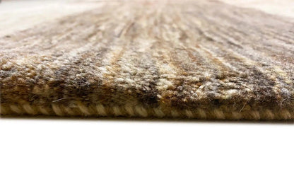 Gabbeh Lori rug with visible pile at the edge, light beige and gray tones