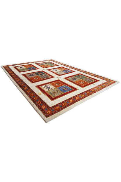 Rug with a colorful square pattern in shades of red and blue, diagonal view