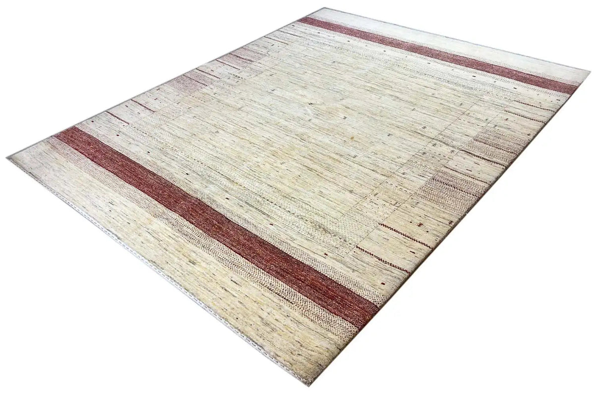 Gabbeh rug lying flat, beige background with a reddish horizontal stripe