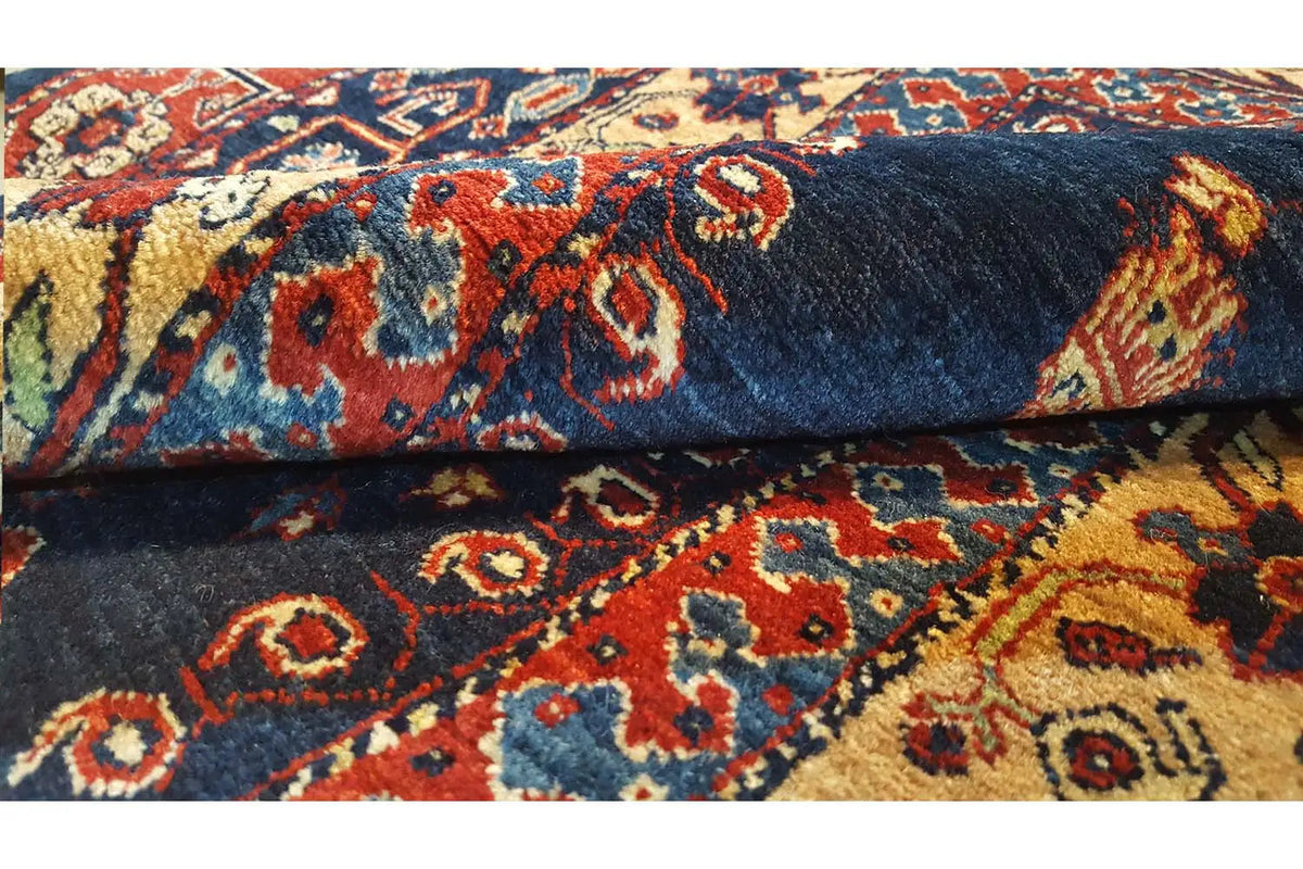 Carpet pile detail: dark blue background with colorful geometric ornaments
