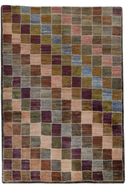 Gabbeh rug in a rectangular shape with a multicolored block pattern on a beige background