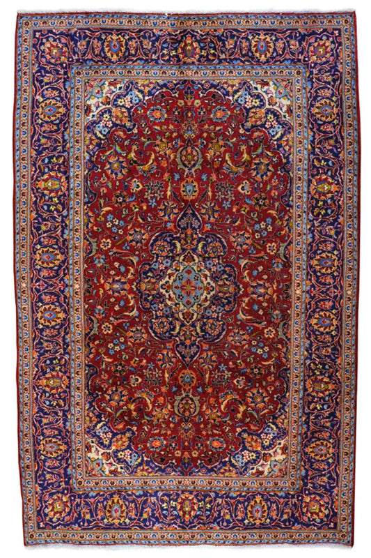 Oriental rug with a red field and blue border ornamentation