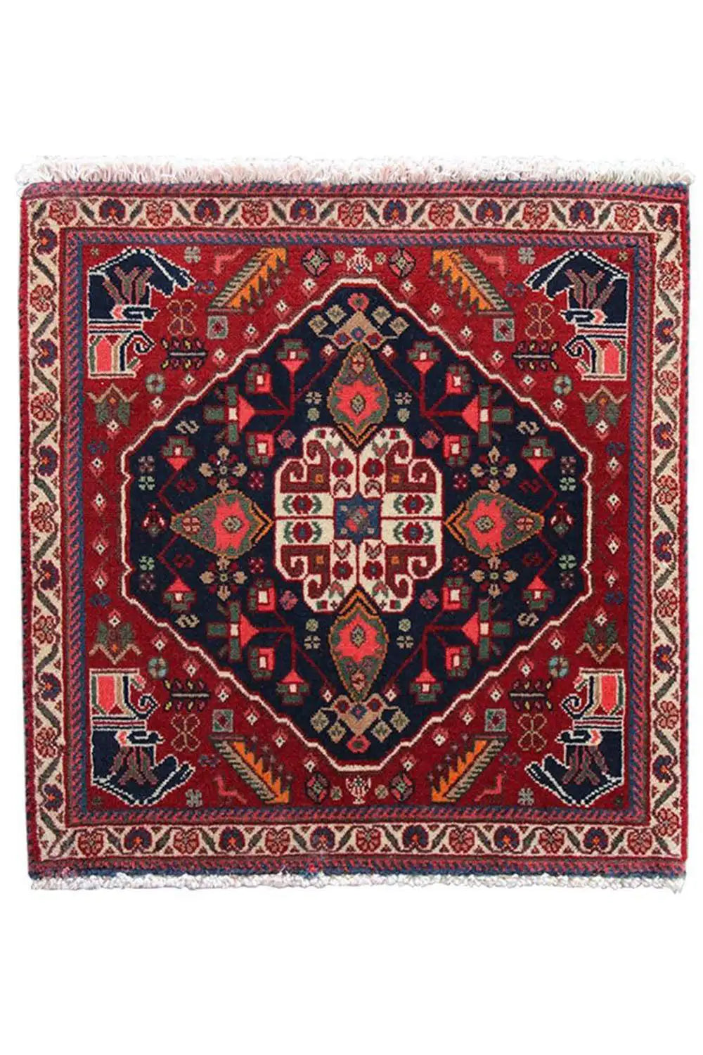 Qashqai rug by Poschti: completely red rug with a dark blue ornamental medallion.