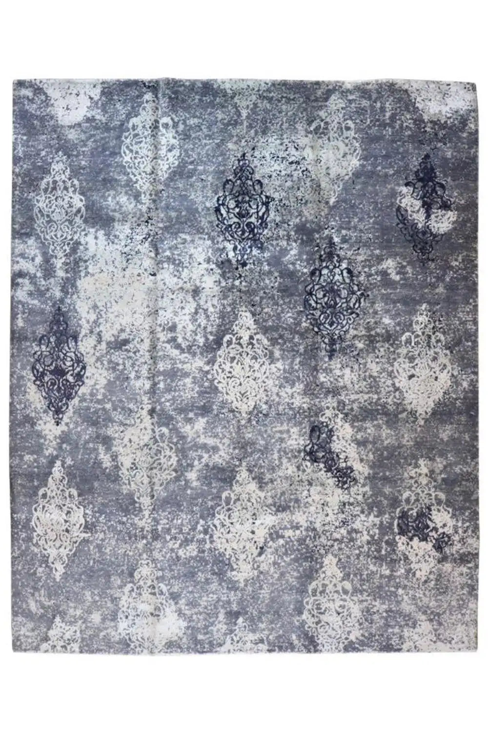 Designer rug with light and dark ornaments on a gray-blue background