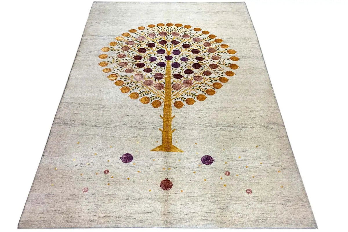 Gabbeh rug at an angle: Tree of Life on light beige with colorful circles