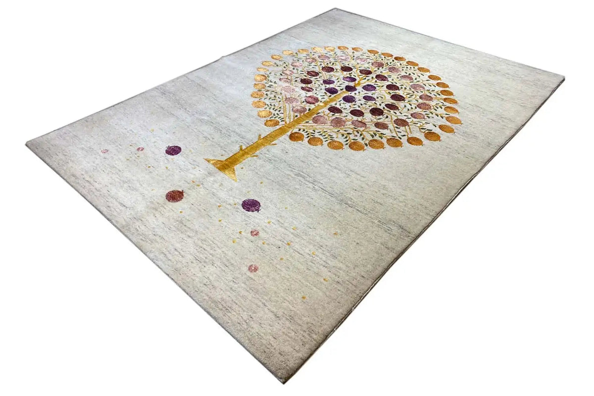 Gabbeh rug with diamond-cut pattern: Tree of Life in gold and purple on a light background
