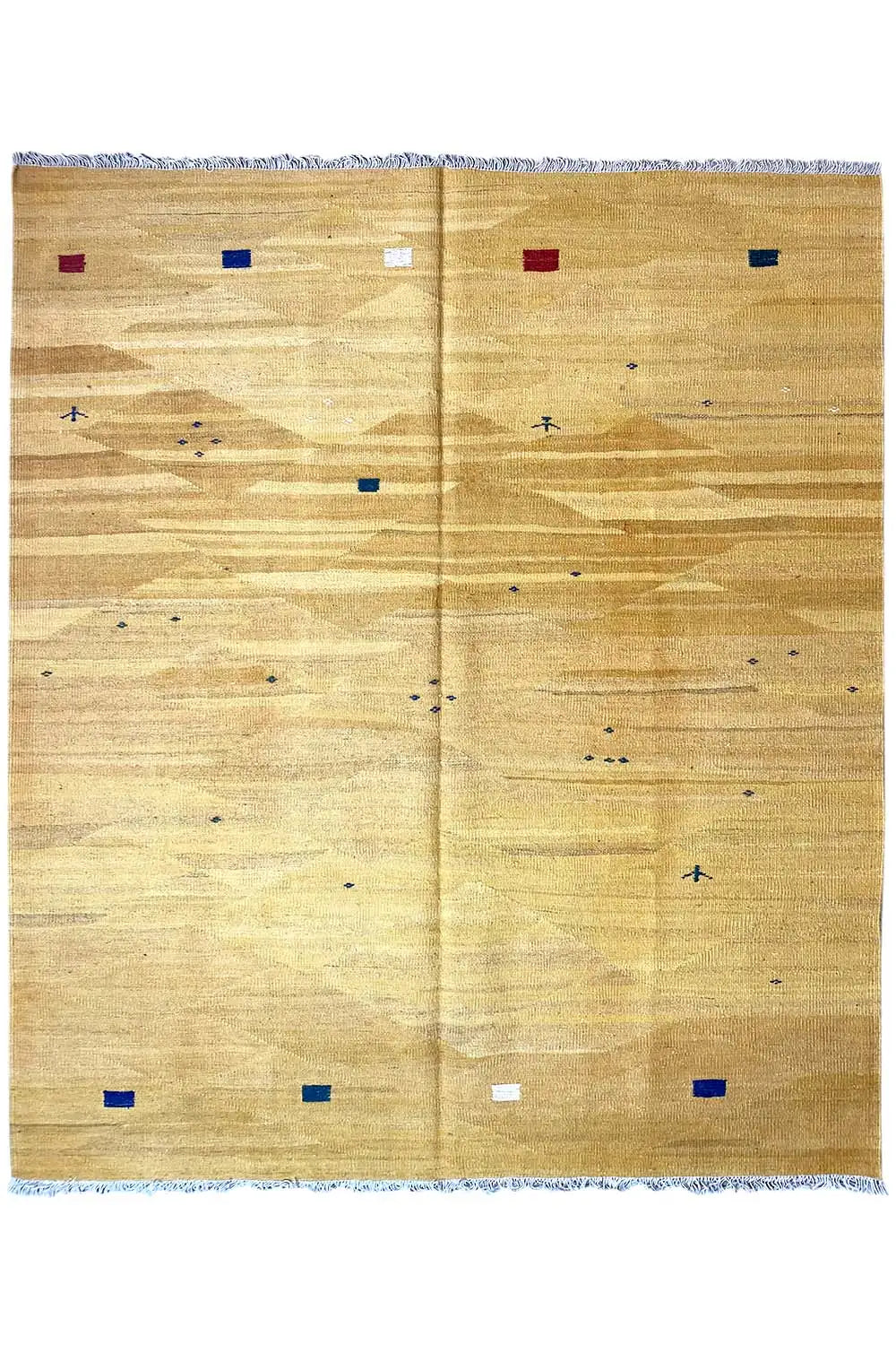 Ochre kilim rug with a geometric pattern of colorful dots and fringes