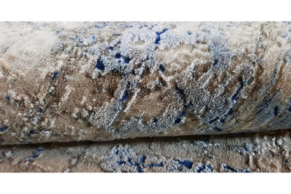 Rug with a light pile and blue color accents, abstract pattern (close-up)