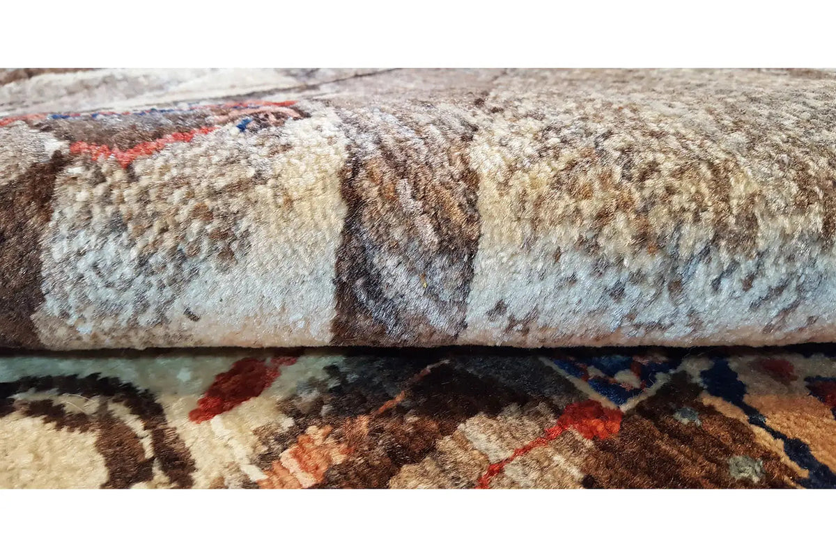 Oriental rug with a multicolored patterned field, dense pile, and border detail
