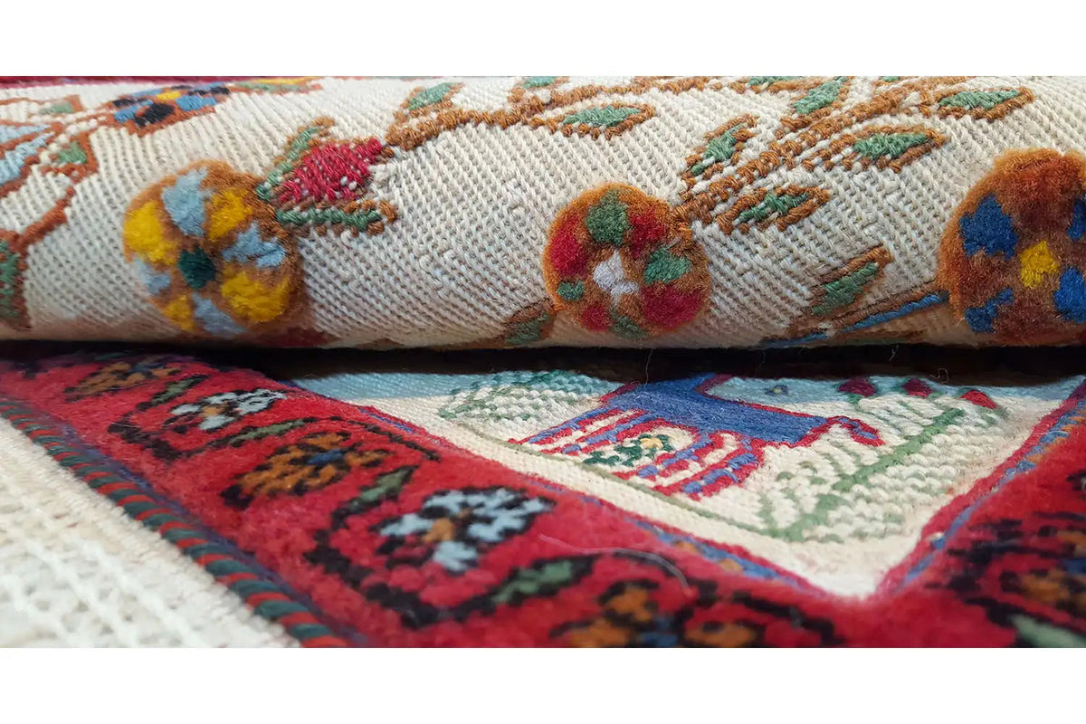 Decorative cushion cover with patterned woven fabric, colorful trim, and tassels