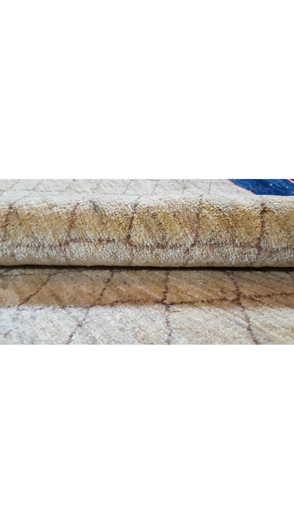 Oriental rug detail with fringes, red-beige texture, and blue border