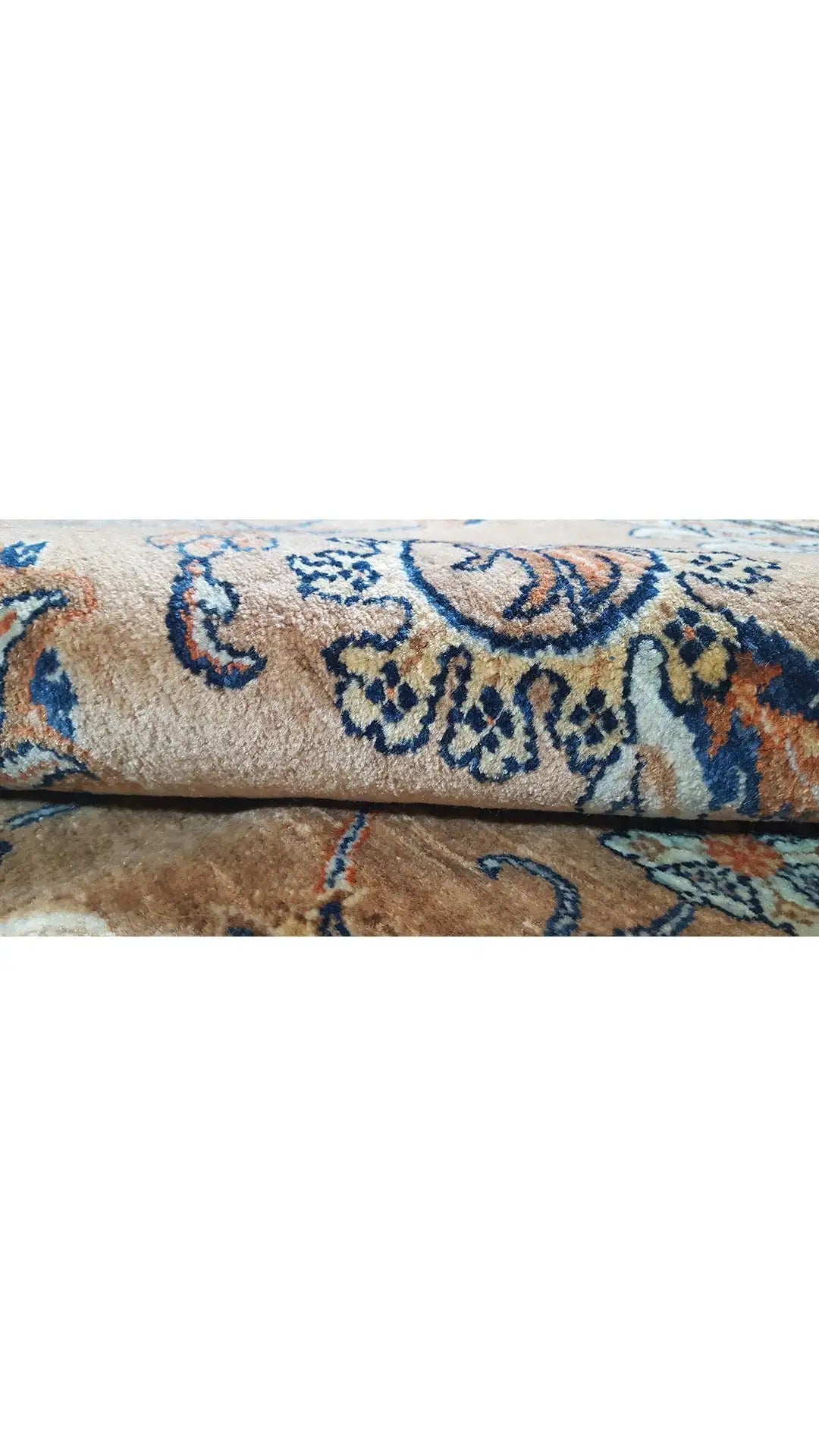 Carpet detail with beige pile and blue ornaments, multicolored medallions