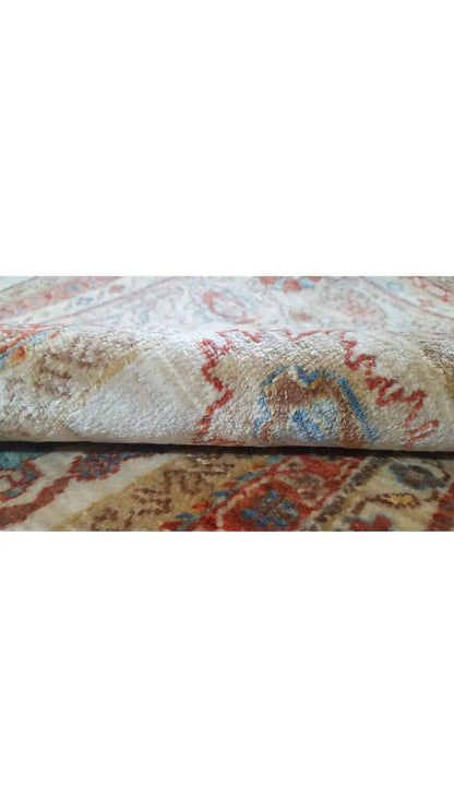 Sultan Abad Exclusive Rug: Close-up of the pile, medallion pattern in warm tones.