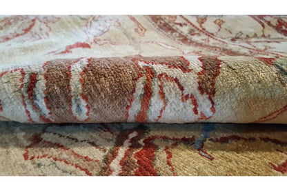Carpet fabric with patterned roll at the edge; short pile in beige and red