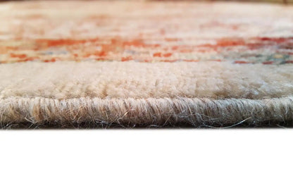 Rug edge with fringes and dense pile, beige base with red accents