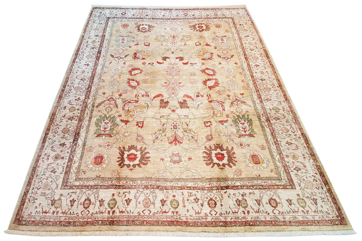 Beige oriental rug with red decorative borders and a central medallion, slightly rectangular