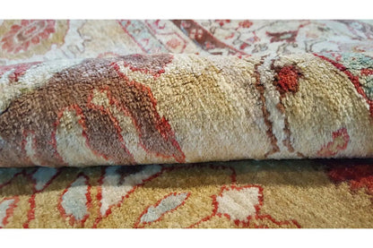 Carpet pattern in detail: short pile fibers, beige background with red ornamental stripes