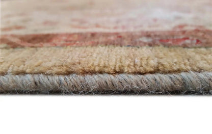 Rug edge in detail with pile and underside, beige and reddish edging strip