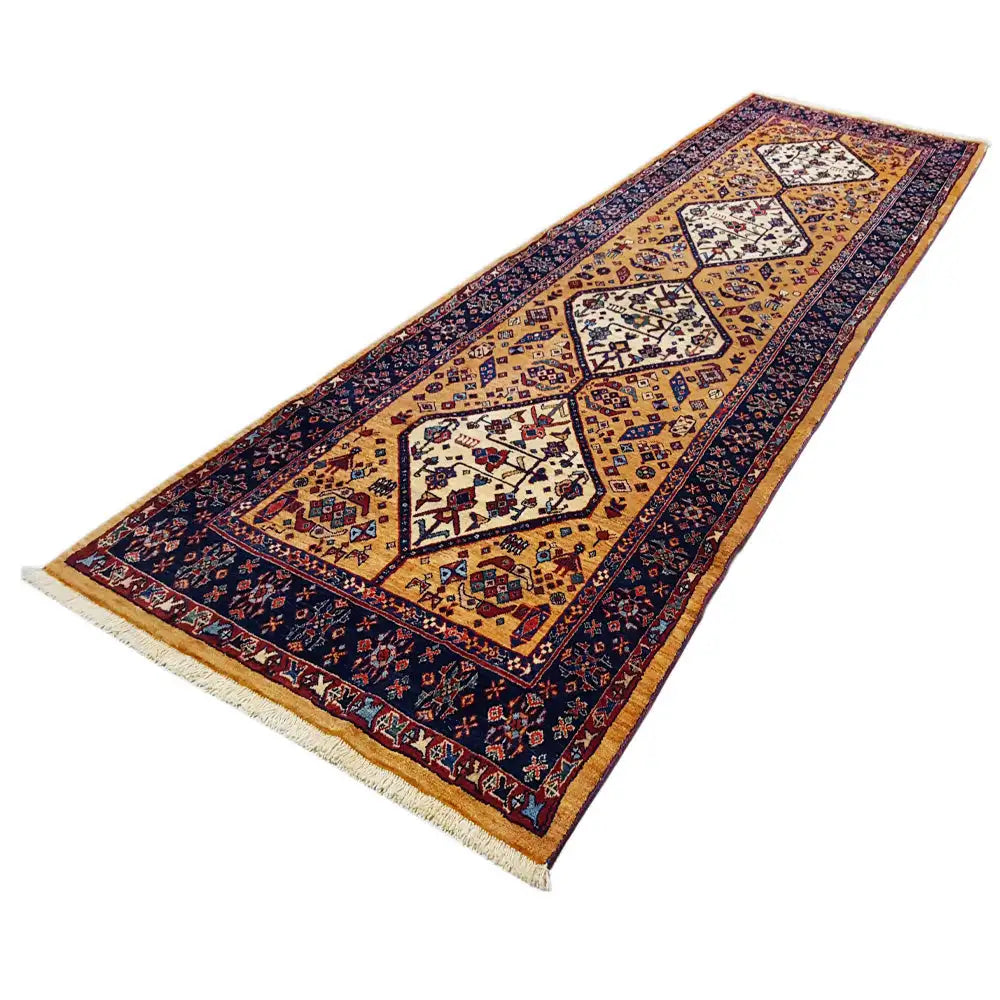Runner rug Diagonal with geometric ornamental pattern in gold, dark blue and red