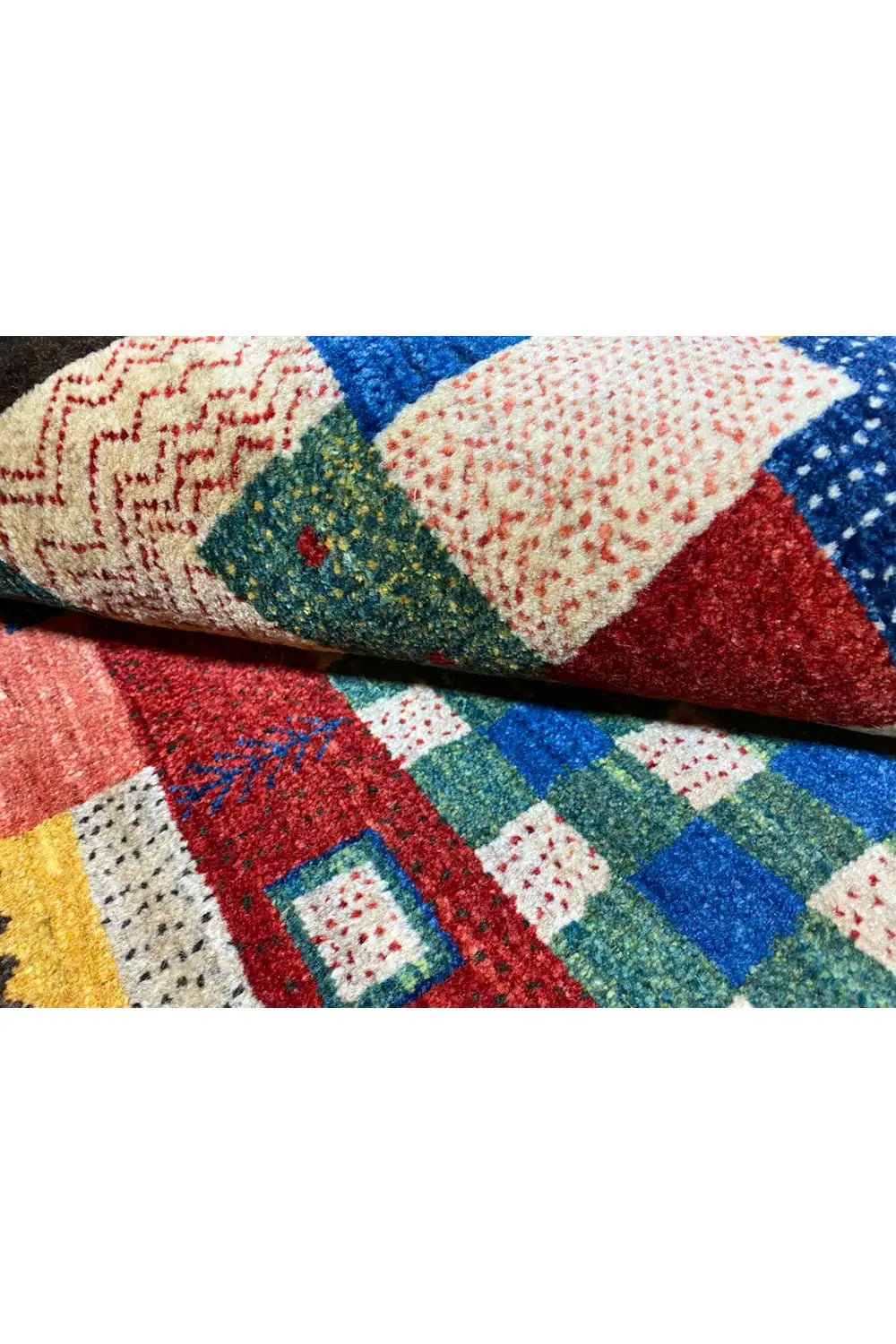 Close-up of the carpet pile: multicolored fabric squares with a dark background