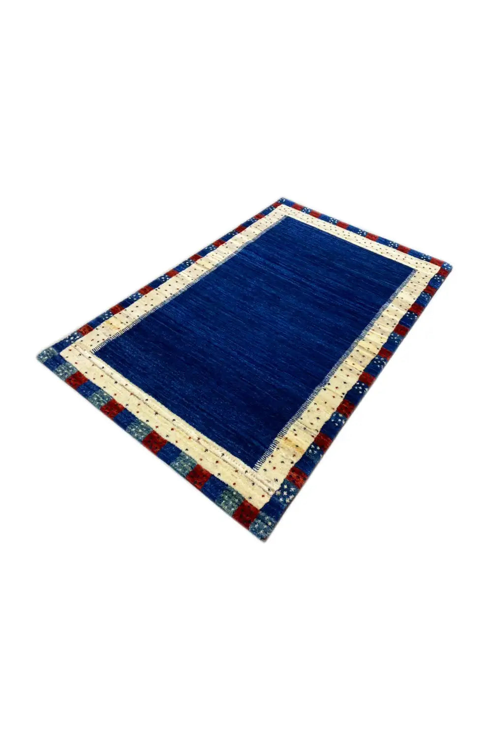 Gabbeh rug in angled view: blue central field, cream border, colorful decorative edging